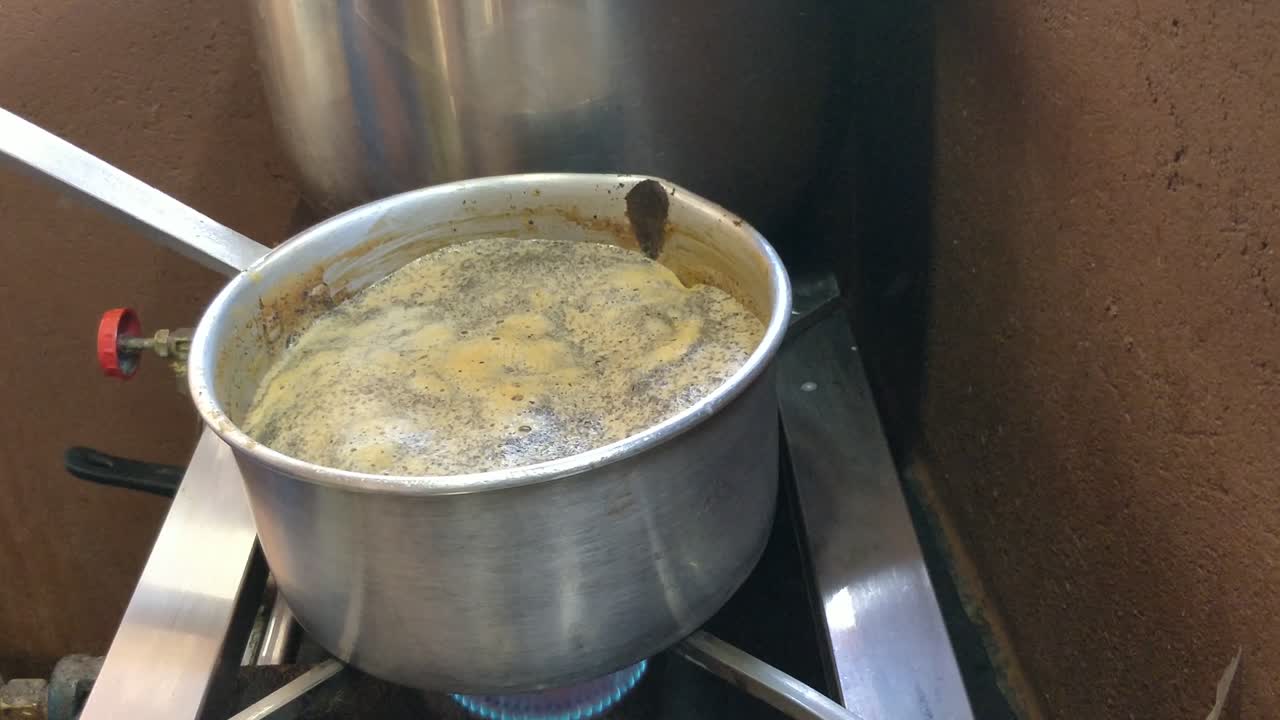 Boiling milk tea on a gas stove