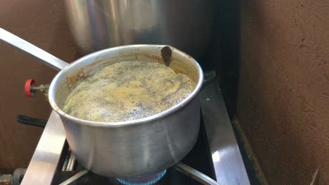 Boiling-milk-tea-on-a-gas-stove