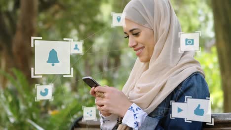 Web-of-connections-icons-against-woman-in-hijab-using-smartphone