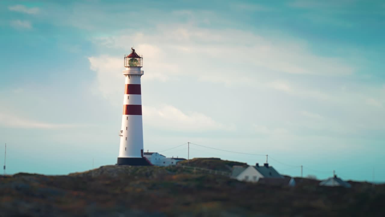 Lighthouse Oks&oslash;y or fyr Oksoy standing on the island in the sea on the southern coast of Norway
