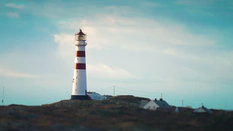 lighthouse oksøy or fyr oksoy standing on the island in the sea on the southern coast of norway