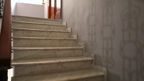 marble staircase with ornate railing in naples