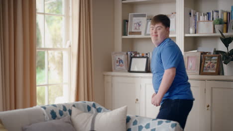 funny-teenager-boy-with-down-syndrome-dancing-in-living-room-special-needs-kid-having-fun-celebrating-with-silly-dance-moves-enjoying-happy-weekend-at-home-4k