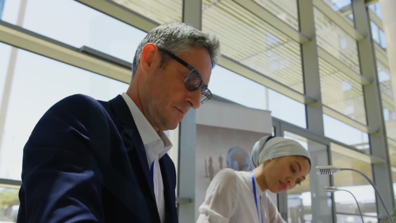 Cyber Security label appearing and expanding colleagues noting meeting points as rings overlay docs