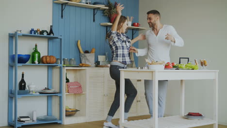 couple dancing in kitchen