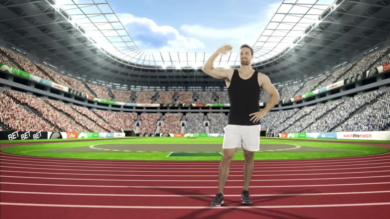 atleta masculino agitando las manos a los espectadores