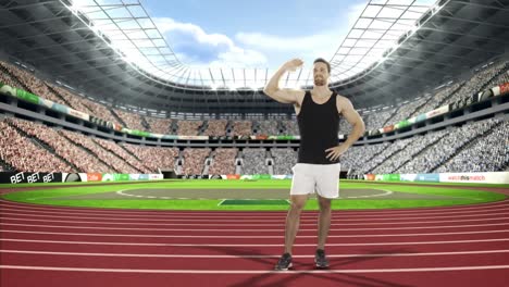 Male-athlete-waving-his-hands-to-spectators