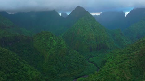 cloudy morning towering jagged mountain peaks vallee de tautira river tahiti island french polynesia aerial drone valley bay teahupoo mont rauiri aorai taiarapu taravao forward parallax motion