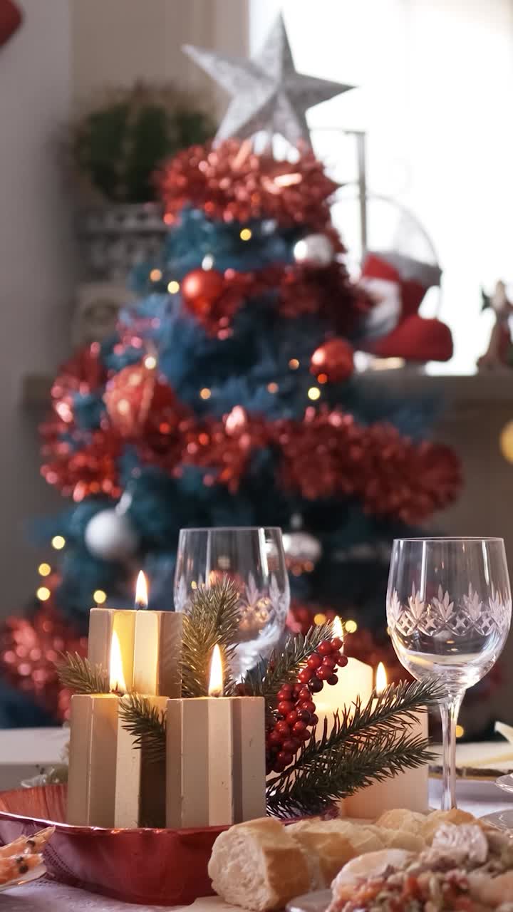 Slow motion video with the focus on Christmas decorations on the table