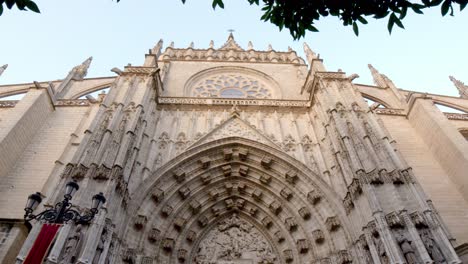 wide shot of gothic church with birds flying.