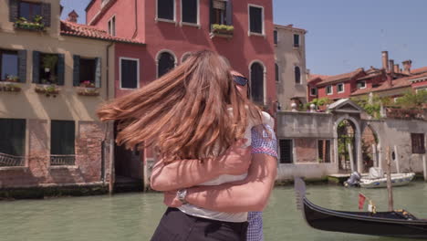 couple hugging in venice, italy