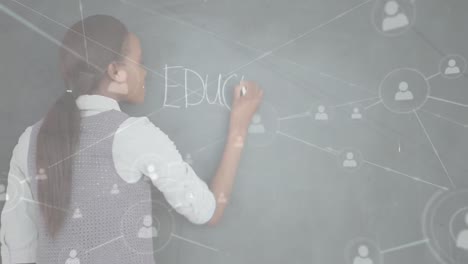 Animation-of-network-of-connections-with-icons-over-female-student-writing-education-on-blackboard