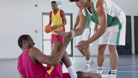 diverse basketball players in an indoor court