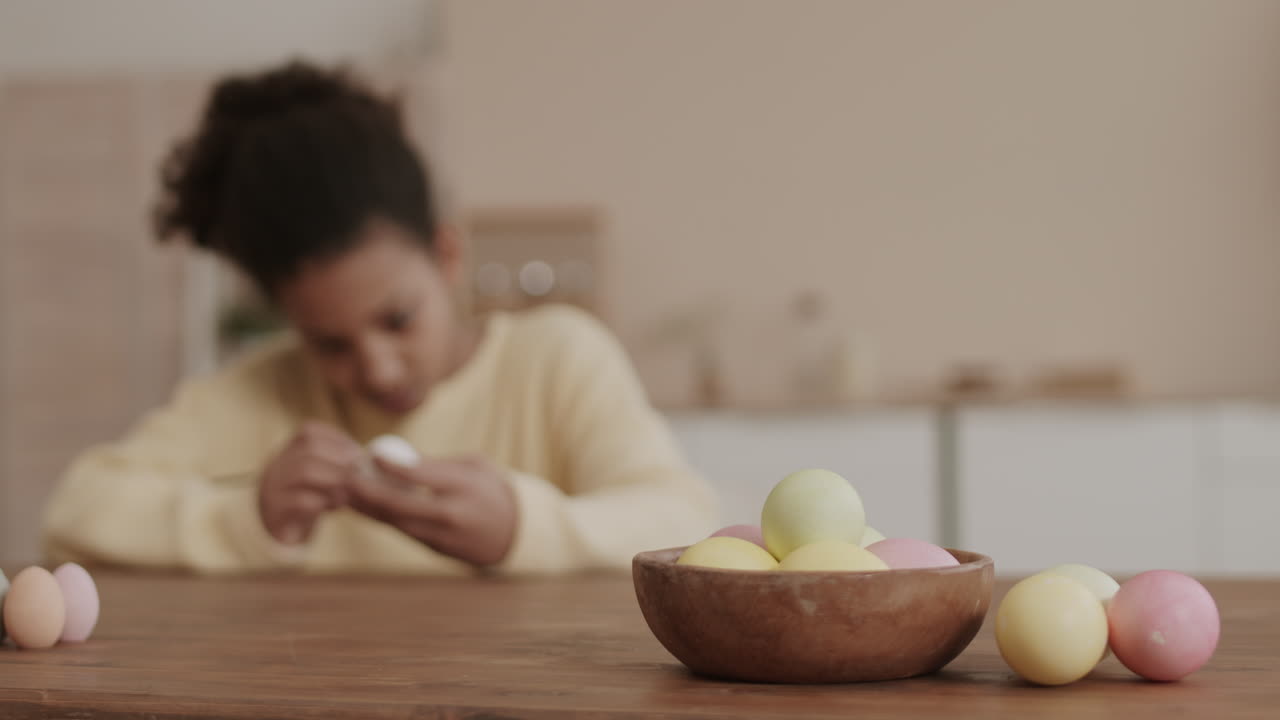 Blurred Person and Colored Eggs
