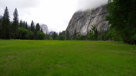 walking through yosemite valley on a cloudy day