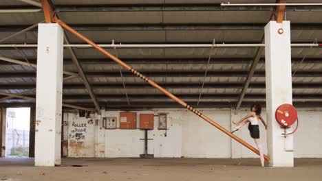 Female-dancer-in-an-empty-warehouse