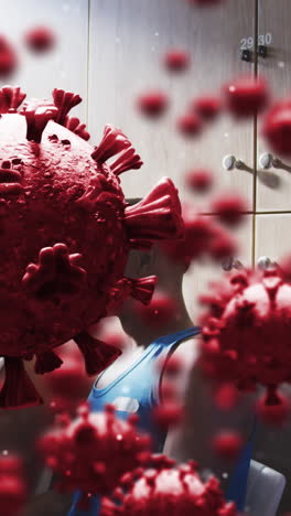 animation of virus cells over diverse group of male football players with coach in changing room