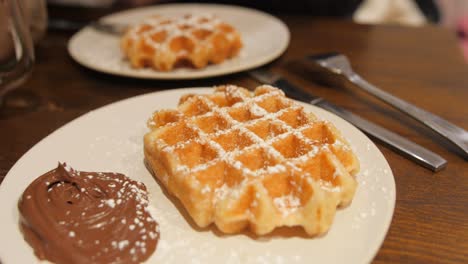 close up of tasty swedish waffles and chocolate in traditional restaurant