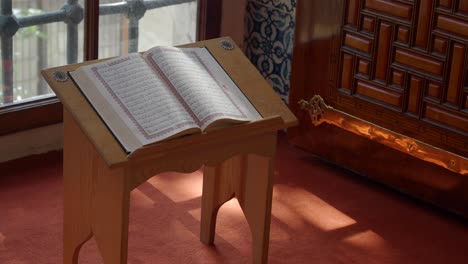 quran on a wooden lectern in a mosque