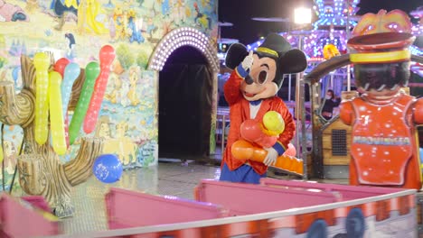 mickey mouse train ride at a carnival