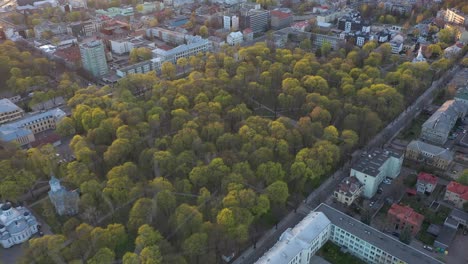 drone aerial view of park ir kaunas, lithuania. spring season. sunset time.