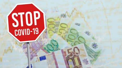 Stop-covid-19-signboard-and-financial-data-processing-against-euro-bills