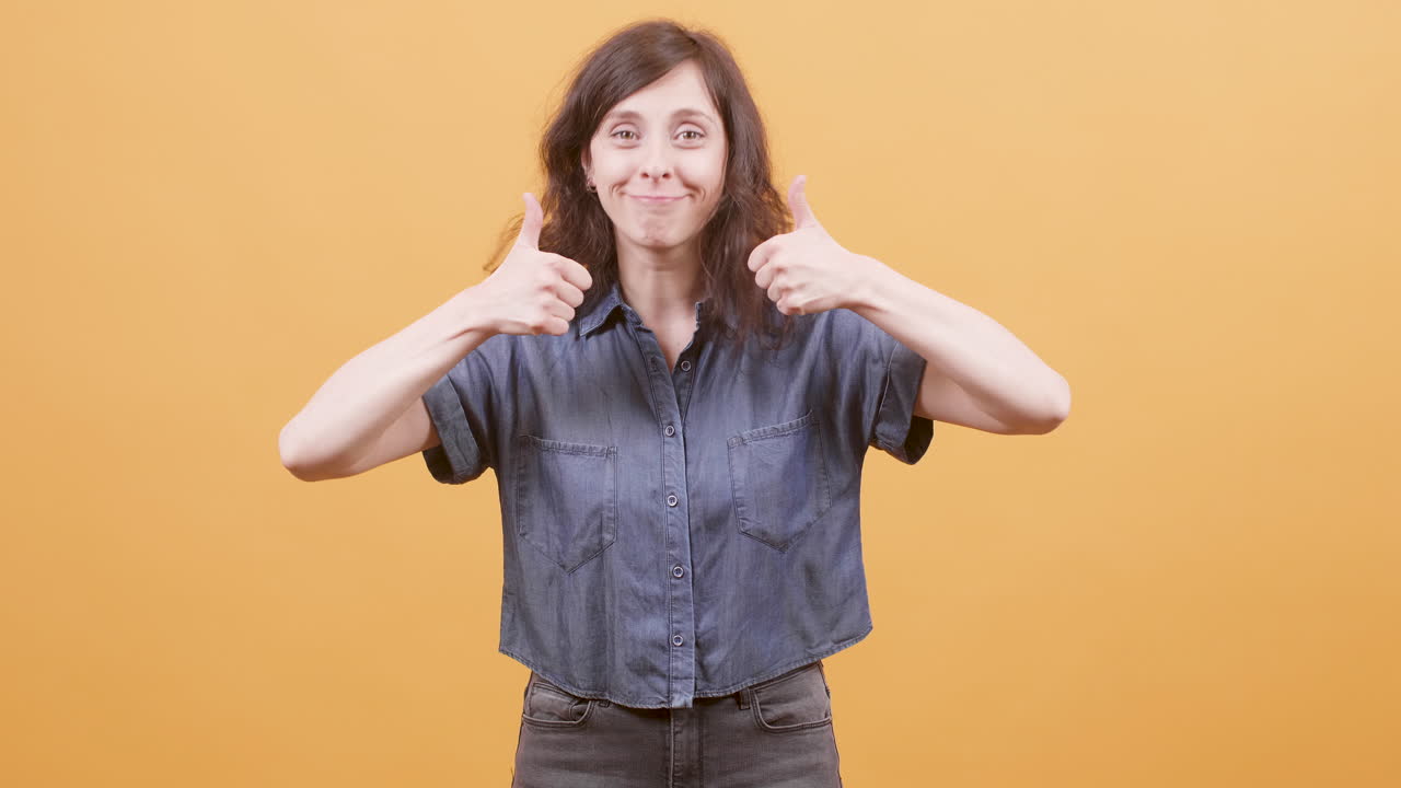 Woman giving thumbs up gesture
