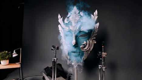 ornate mask photo shoot in studio with smoke