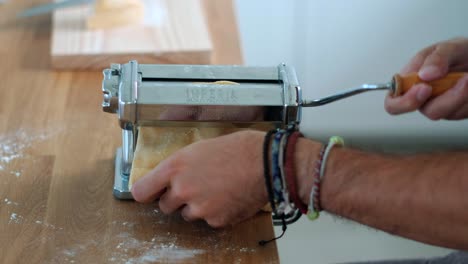 Homemade-Pasta-Passion:-Close-Up-of-Unrecognizable-Man-Creating-Tagliatelle---Slow-Motion-Delight