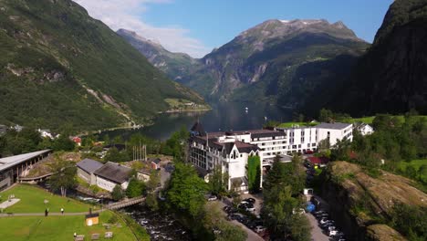 Aerial-Boom-Shot-Above-Village-of-Geiranger-in-Geirangerfjord,-Norway