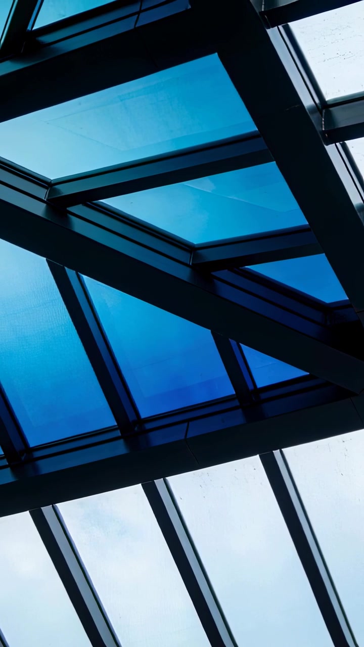 Vertical video: Camera tilting upward inside, graphics tracing skylight beams and drops for design
