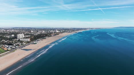 High-elevation-drone-shot-looking-down-at-Santa-Monica-Beach-in-California