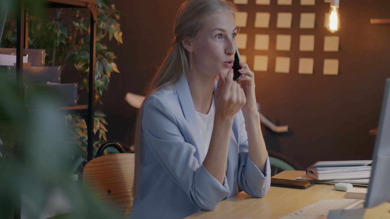 Woman on Phone Call in Modern Office