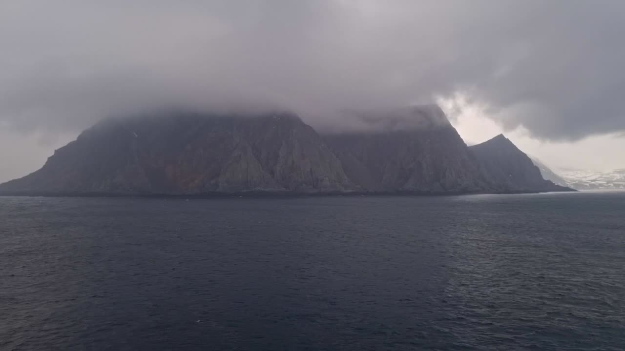 The view of clouds and mist from the deck of a cruise ship sailing along the coast of Norway