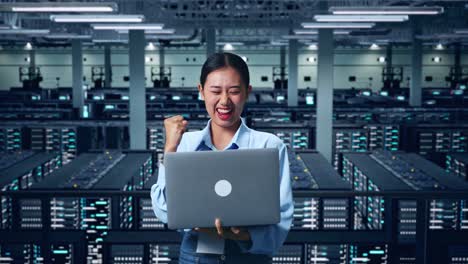 woman celebrating success in a data center