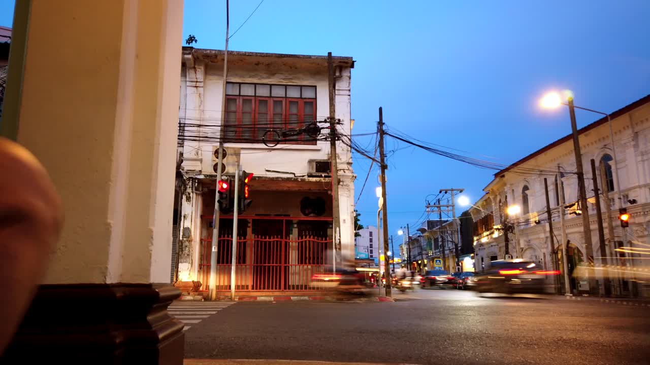 Hyperlapse landscape architecture view of the ancient local street with beautiful shino-portuguese architecture town house building in Phuket old town in evening sunset time