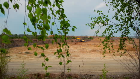 mining construction industry. large yellow excavator moving stone in a quarry