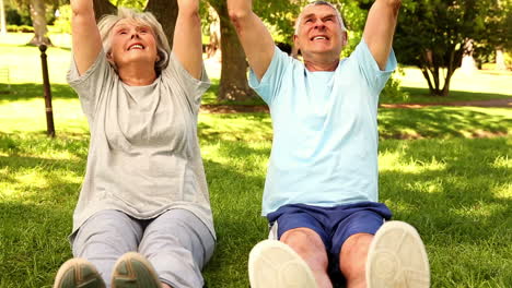 retired couple exercising together outside