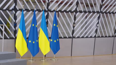 EU-and-Ukrainian-flags-in-the-Europa-building-in-Brussels,-Belgium