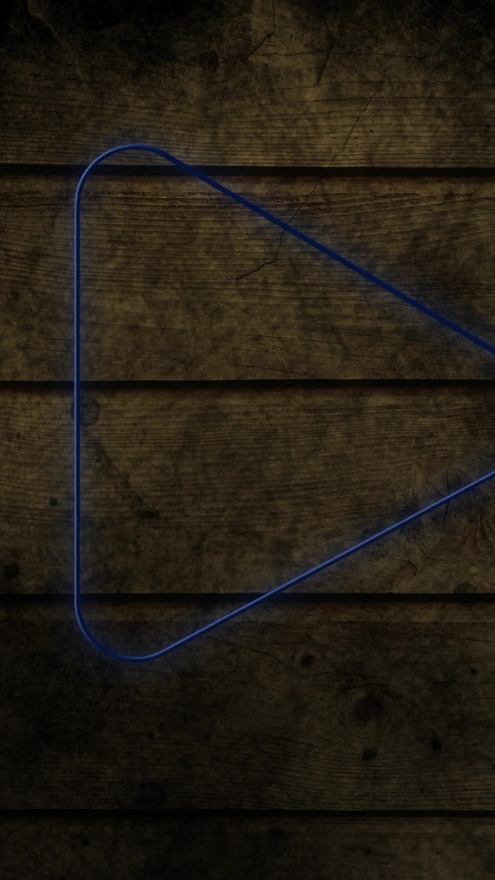 Animación de un icono de flecha de neón brillante en una pared de ladrillo.
