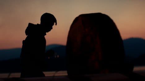 Silhouette of a child at sunset
