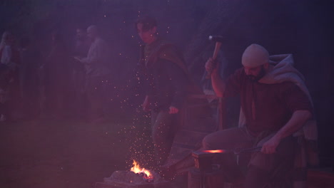 medieval blacksmith at night