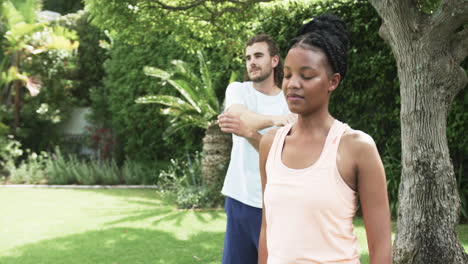 young african american woman and young caucasian man enjoying outdoor activities