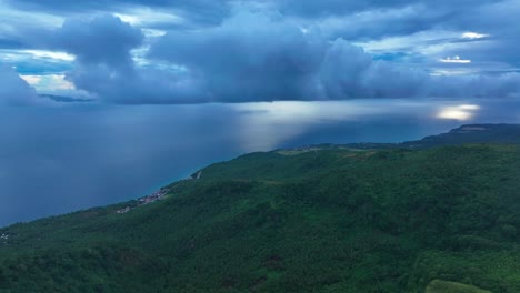 Dramatic-cloudscape-over-sea-of-and-green-island-in-Biliran-Island,-Philippines