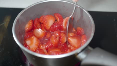 cooking strawberries in a pot