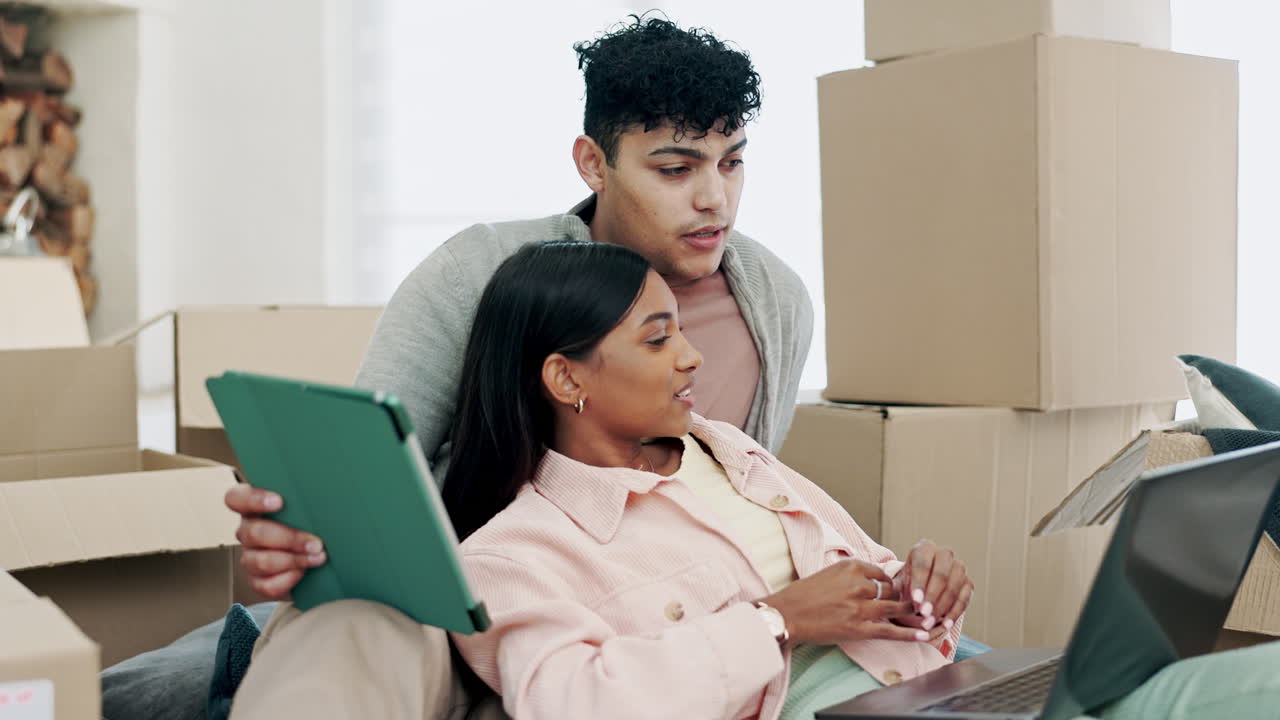 Couple, tablet and laptop in real estate planning
