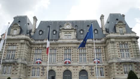 french town hall with flags