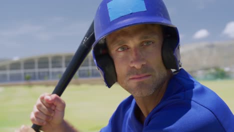 baseball players holding baseball bat