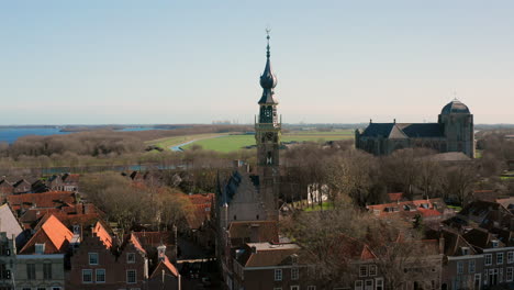 aerial: the historical town of veere with an old harbour and churches, on a spring day