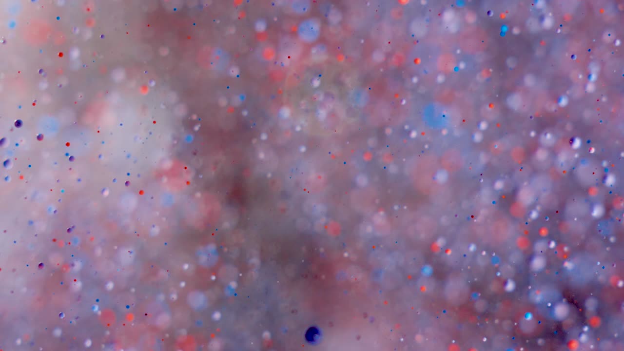 movimiento caótico abstracto de partículas en el espacio. movimiento lento colores brillantes burbujas pintura de aceite universo moviéndose multicolor de cerca. pintura acrílica. superficie hipnótica fantástica. big bang. nanotecnología.